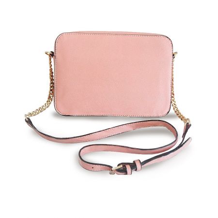 Full view of the pink leather crossbody bag with both gold chain and leather straps attached.