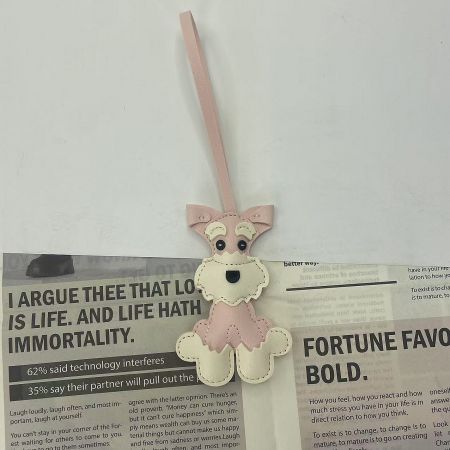 The pink and white version of the Schnauzer dog leather bag charm.