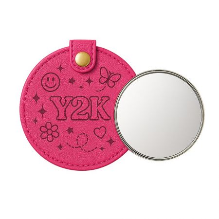 Stylish pink leather compact mirror with a protective pouch.