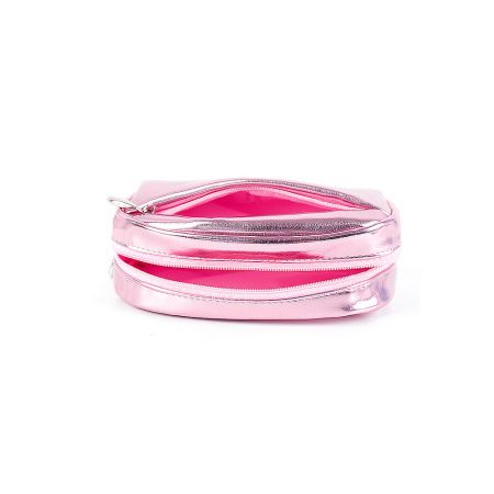Close-up of the reflective pink surface of the cosmetic travel pouch.