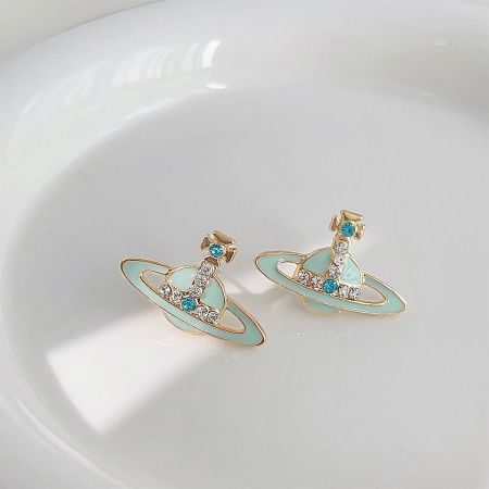 Detailed shot of the planet stud earring, highlighting the intricate design of the rings and central stone.