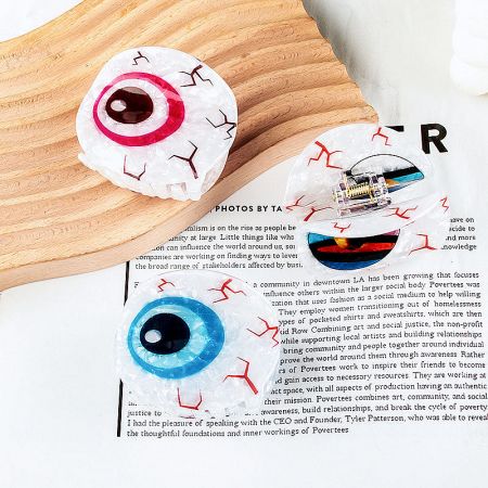 A collection of Evil Eye hair clips in different colors, arranged artistically.