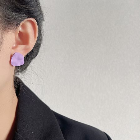 Model showcasing the purple matte enamel irregular shape stud earring.