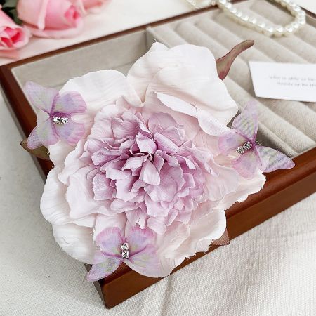 Detailed view of the purple peony flower hairclip with delicate petal details.