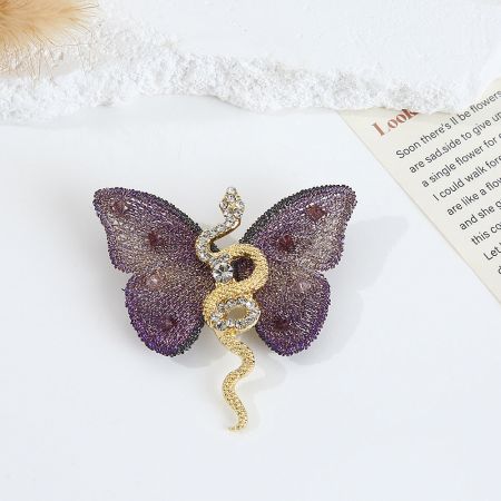 Snake Embroidery Butterfly Brooch (5 pcs) - Close-up of the Snake Embroidery Butterfly Brooch in purple, showcasing the intricate gold metal snake detail and sparkling rhinestones on the butterfly wings.