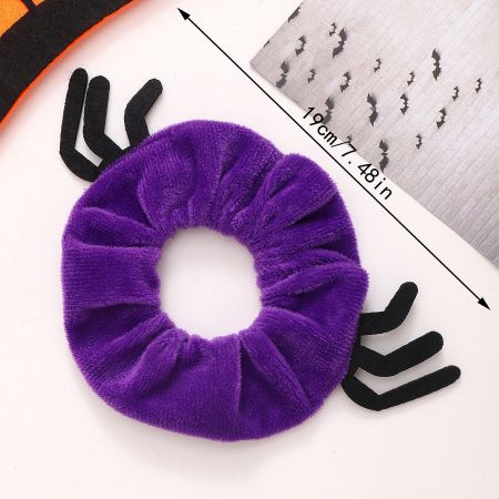 A soft purple Halloween scrunchie designed with spooky spider legs.