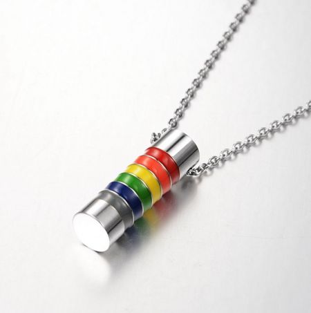 LGBT Pride Rainbow Cylinder Necklace - A close-up of the LGBT Pride Rainbow Cylinder Necklace, showing the vibrant enamel colors on the stainless steel pendant and the polished silver chain.
