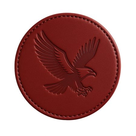 Bold red leather coaster with a stamped eagle logo, ideal for corporate branding.