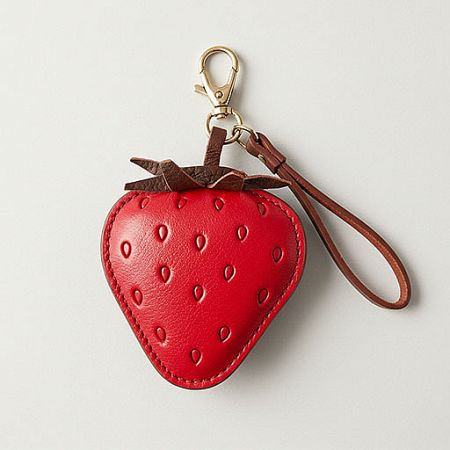 Customizable Fruit-Themed Leather Bag Charms - A vibrant red leather strawberry-shaped bag charm with a gold lobster clasp, showcasing custom wholesale options from JR Fashion Accessories.