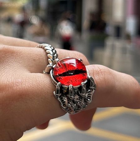 A unique silver ring designed in the shape of red lips, another example of men's fashion rings.