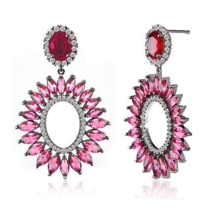 Close-up view of the Red Radiant CZ Earring showcasing the sunburst design with red and pink gemstones.