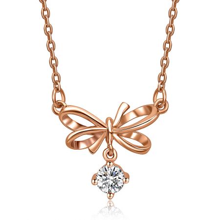 Full view of the 'Take A Bow' rose gold necklace, showing the chain and spring clasp.