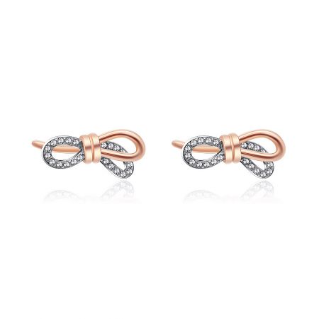 Tied Ribbon Bow Earrings - A close-up of the Tied Ribbon Bow Earrings, showcasing the two-tone rose gold and rhodium plating and the sparkling cubic zirconia stones.