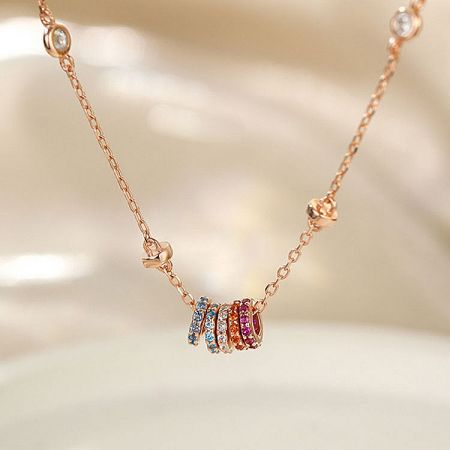 Rose gold version of the rainbow zircon charm necklace.