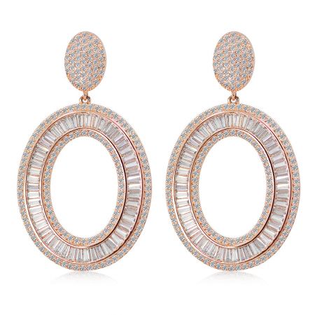 Oval Drops Of Fabulous - A pair of Oval Drops Of Fabulous earrings in rose gold, featuring an elegant double-layered oval design with sparkling white cubic zirconia baguette stones.