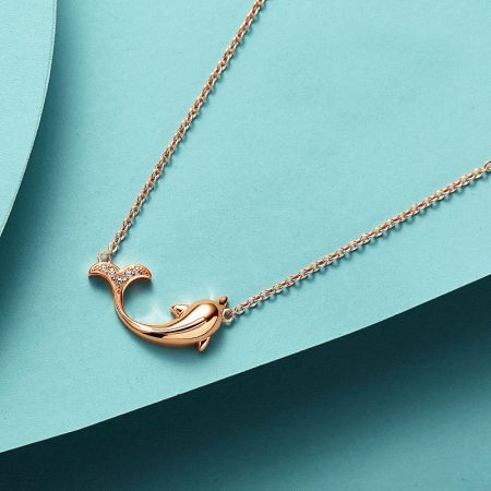Elegant rose gold dolphin necklace featuring brilliant diamond accents for extra sparkle.