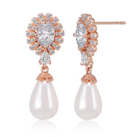 Close-up detail of the dangle pearl earring, highlighting the brilliant-cut cubic zirconia and the lustrous teardrop shell pearl.