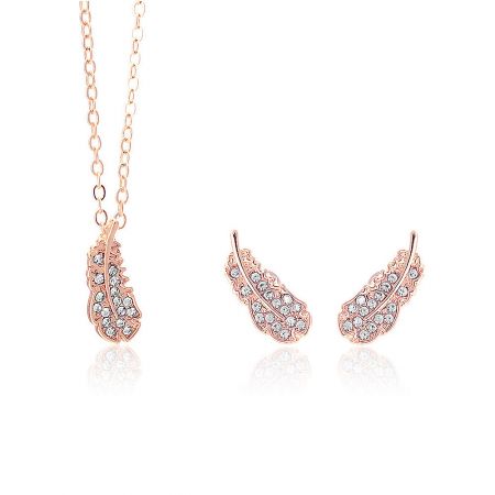 Delicate rose gold feather jewelry set with necklace and earrings.