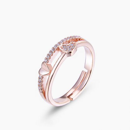 Close-up of the rose gold heart ring showcasing the clear CZ gemstones.