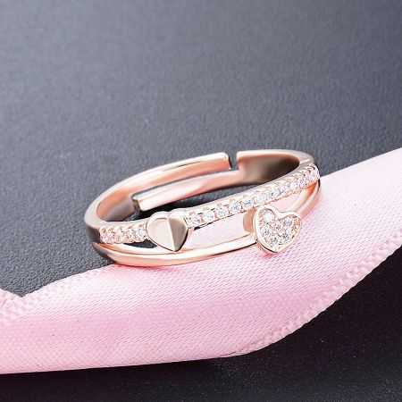 Two rings from the set, highlighting the heart-shaped design.