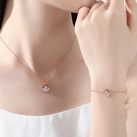 Sterling silver whale charm bracelet displayed as part of a matching set.