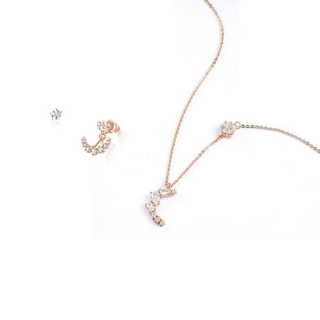 Close-up of the sparkling cubic zirconia on the rose gold moon and star jewelry set.
