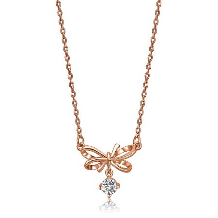 Rose Gold Take A Bow Necklace with A Diamond - A delicate rose gold plated necklace featuring a bow-shaped pendant with a central cubic zirconia diamond, displayed on a white background.