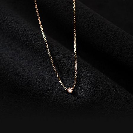 Detailed view of the rose gold finish on the sterling silver CZ necklace.
