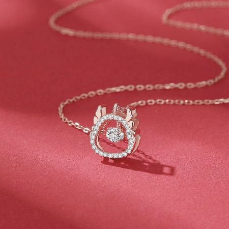 The elegant rose gold version of the Year of the Dragon spinning pendant necklace.