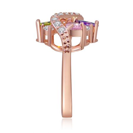 A detailed shot of the rose gold spiral ring, focusing on the arrangement of the multi-colored gemstones.