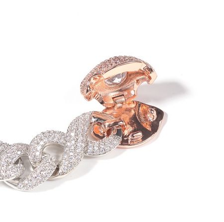 Close-up of the interlocking rose gold and silver links, highlighting the brilliant cubic zirconia embellishments.