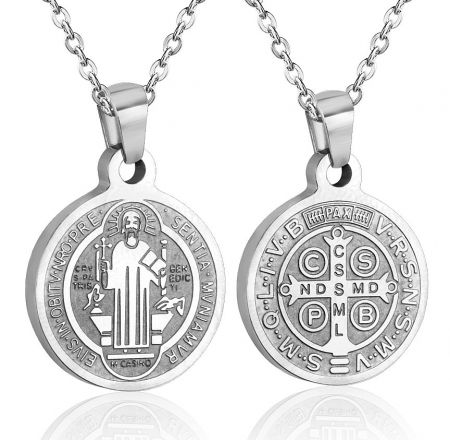 Two silver Saint Benedict medal pendants showcasing detailed religious engravings.
