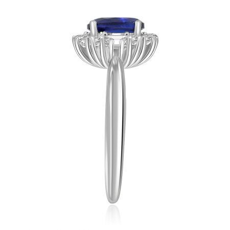 Top-down view of the Sapphire and Zirconia Ring, emphasizing the classic halo design and the deep blue color of the central stone.