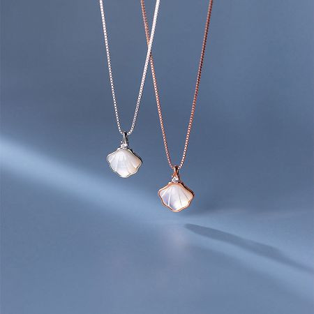 Sterling Silver Seashell Mother of Pearl Pendant Necklace (Set of 5) - A pair of sterling silver seashell pendant necklaces, one in a silver finish and the other in rose gold, showcasing the mother-of-pearl inlay.