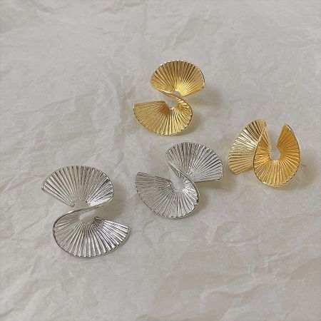 A set of the geometric earrings displayed in both 14K gold plated and silver finishes.