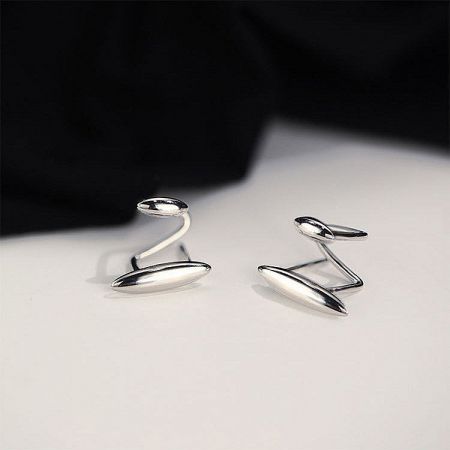 Minimalist sterling silver wrap earrings with a sleek, curved abstract shape.