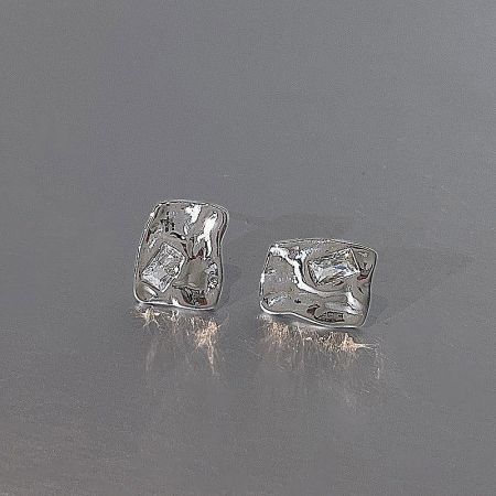A pair of silver-plated stud earrings featuring a unique abstract design.