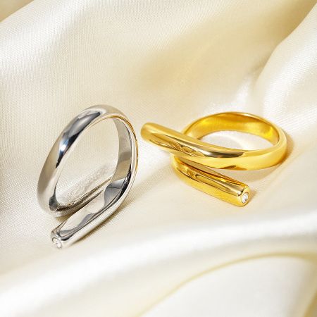 Stainless Steel Geometric CZ Stone Rings - Set of 5 - A set of stainless steel geometric rings with single CZ stones, displayed in both silver and gold finishes on a neutral background.