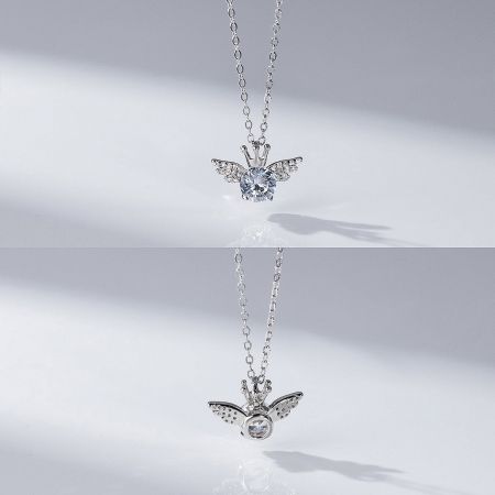 Two variations of the angel-shaped pendant, highlighting different gemstone options.