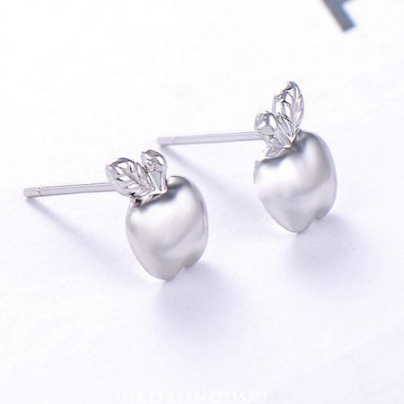Close-up view of the polished 925 sterling silver apple stud earrings, highlighting the leaf design.