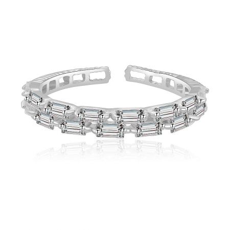 Sterling Silver Delicate Baguette Ring - A delicate sterling silver baguette ring with rhodium plating, featuring a row of sparkling cubic zirconia stones, shown against a clean white background.