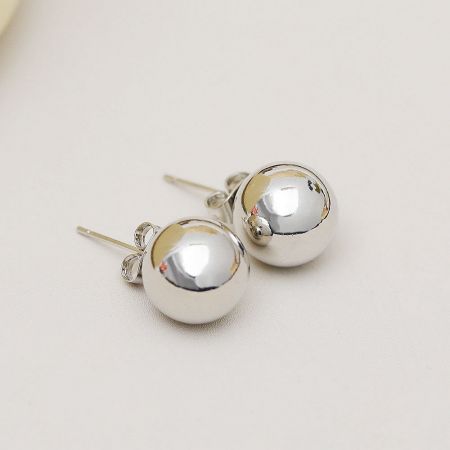 A pair of classic 12mm silver ball stud earrings on a white background.