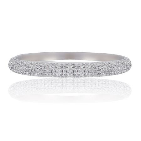 Brilliant Shine Bangle - The Brilliant Shine Bangle, a rhodium-plated brass bracelet adorned with numerous pave-set cubic zirconia stones, shown against a white background.