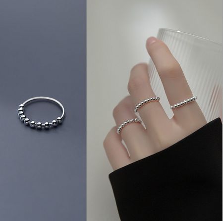 925 Sterling Silver Anti Anxiety Ring - A stylish 925 sterling silver anti-anxiety ring with movable beads, shown on a finger to demonstrate its use.