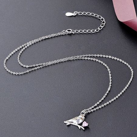 Full view of the 925 sterling silver sparrow bird pendant on its delicate choker chain.