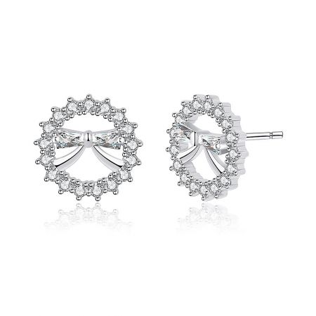 Close-up detail of the Round Mini Bow Stud Earring, highlighting the rhodium-plated finish and the halo of clear cubic zirconia gemstones.