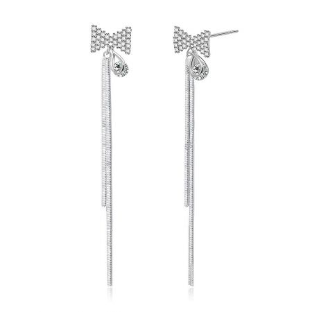 Side profile of the silver bow earring showcasing the dangling teardrop stone and sleek, modern design.