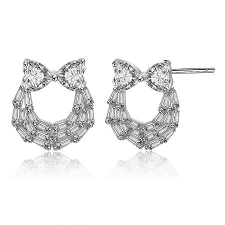 Side profile of the Two Hearts And Baguette Earrings, detailing the intricate bow-tie design and sparkling crystal arrangement.