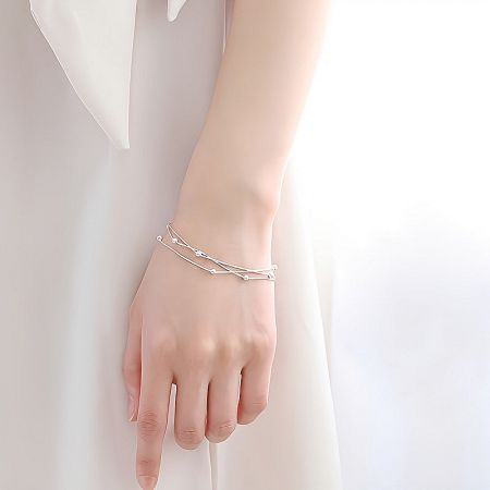 Elegant product shot of the sterling silver multi-layer snake chain bracelet.