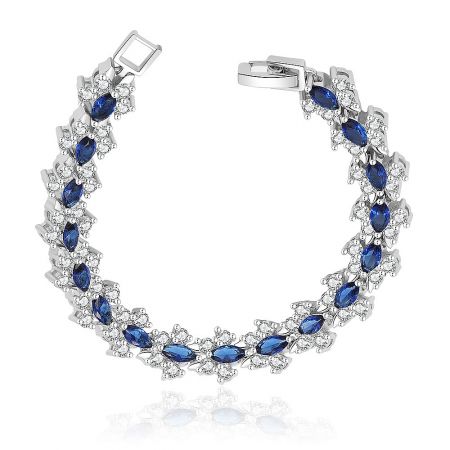 Tennis Montana Tear Bracelet - Close-up of the Tennis Montana Tear Bracelet, showcasing the intricate setting of blue Montana glass and clear AAA+ Cubic Zirconia on a rhodium-plated brass band.